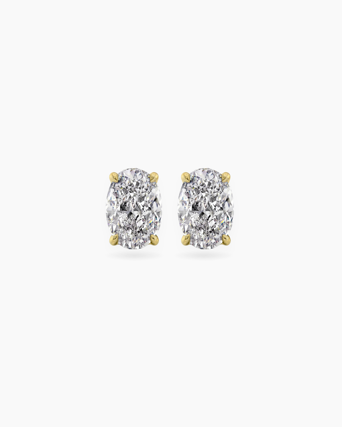 Oval cut lab grown diamond stud earrings in 18K yellow gold