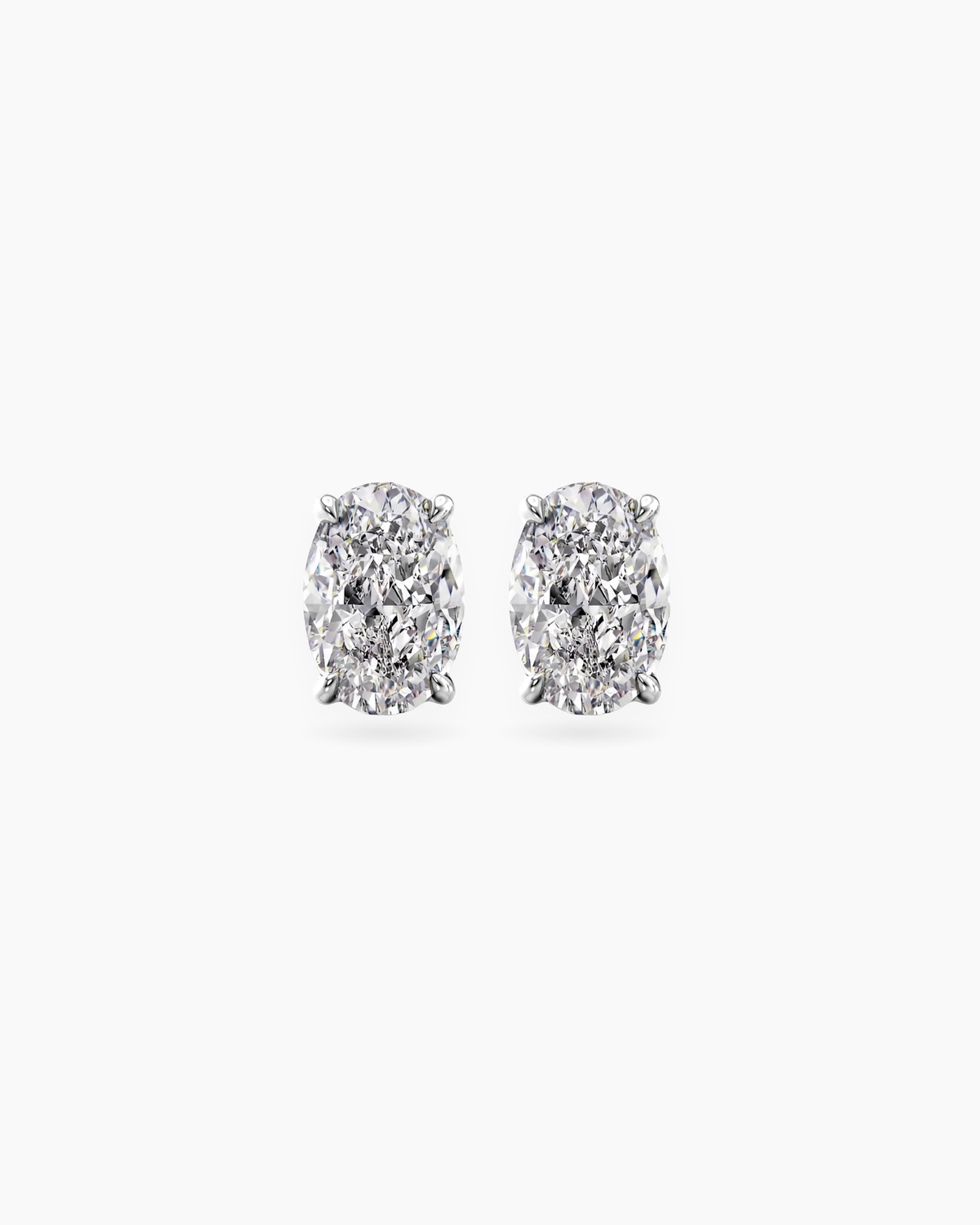 Oval cut lab grown diamond stud earrings in 18K white gold